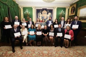 The Class of 2024 pose for a photo at graduation in Hillsborough Castle.